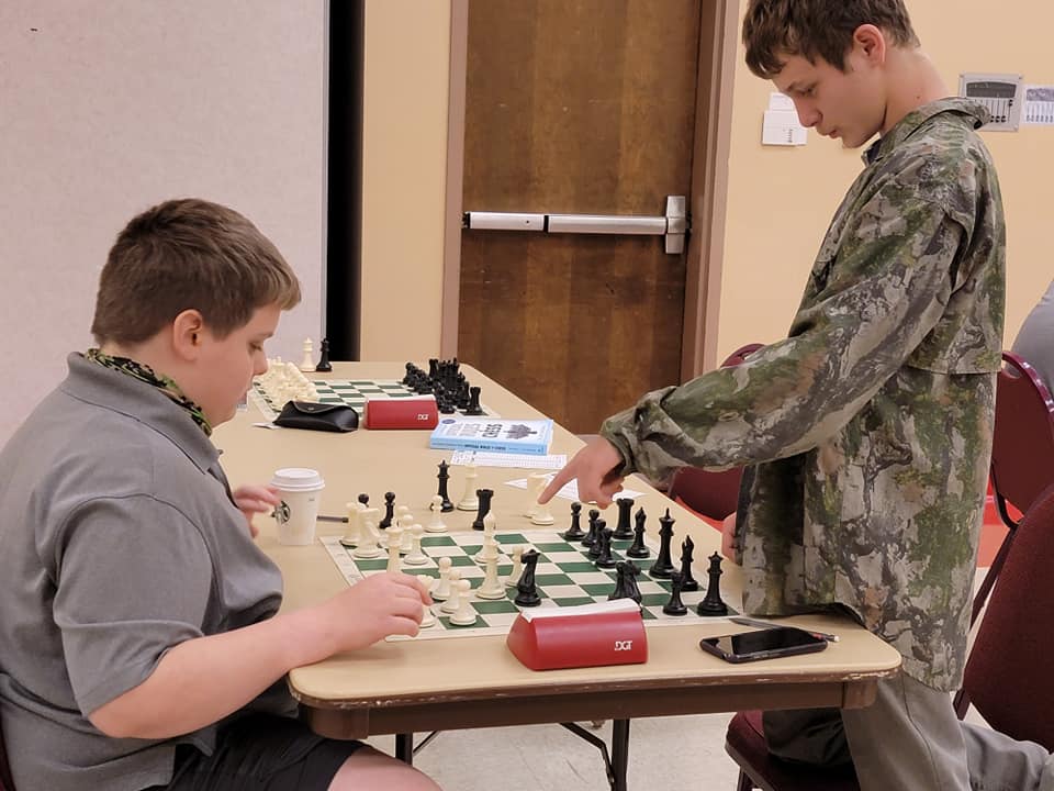Kids playing chess at the monroe chess club